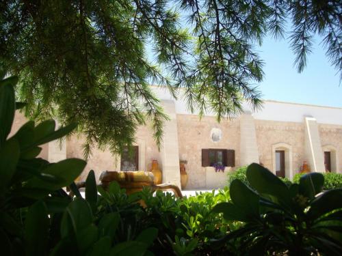 a building with a couch in front of it at Masseria Nuova in Francavilla Fontana