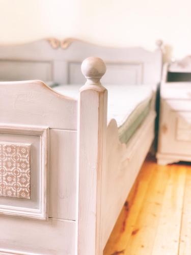 a white bed frame in a bedroom at Linsell in Sveg