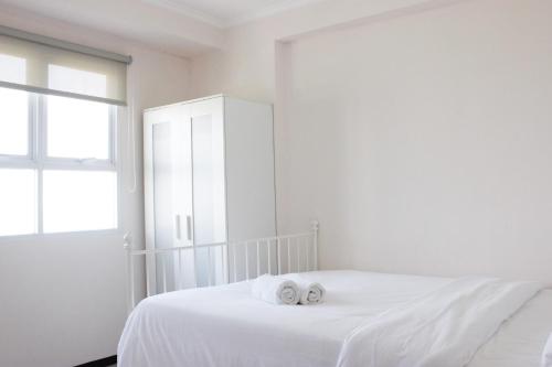 Ένα ή περισσότερα κρεβάτια σε δωμάτιο στο Modern Look 2BR Gateway Pasteur Apartment By Travelio