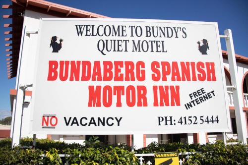 a sign for a hotel in front of a building at Bundaberg Spanish Motor Inn in Bundaberg