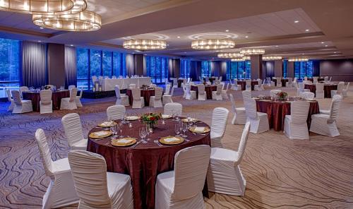 a banquet hall with tables and white chairs at Hyatt Regency Minneapolis in Minneapolis