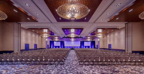a large room with rows of chairs in front of a stage at Hyatt Regency Minneapolis in Minneapolis