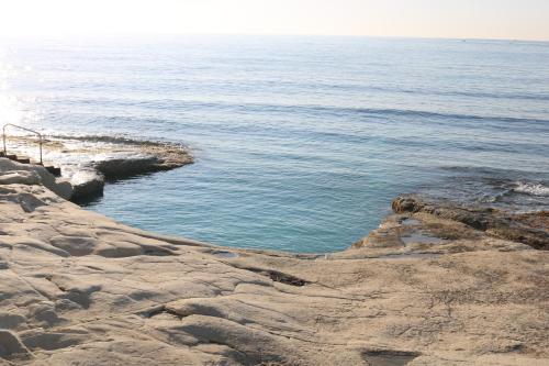 a large body of water next to the ocean at Seaside Apartments in Marsaskala