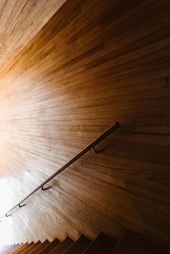a metal hand rail on a wooden floor at Seastacks at The Denison in Bicheno