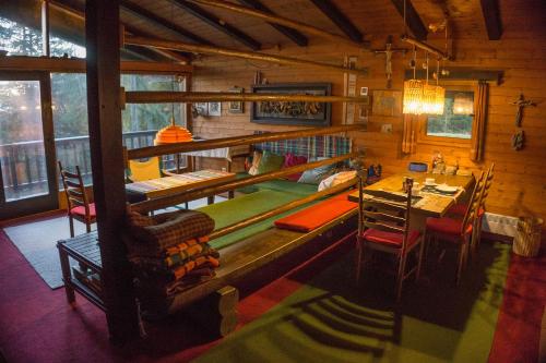 a dining room with a pool table in a cabin at Almhaus Goldeck in Schwaig