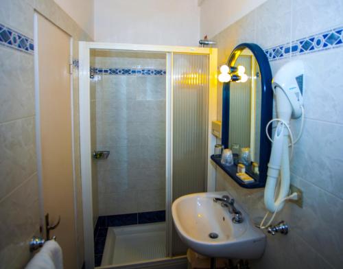a bathroom with a shower and a sink at Hotel Delle Rose in Bonassola
