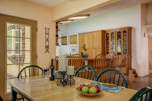 a kitchen and dining room with a table and chairs at Pecan Point by KABINO Mountain Trail Access Foosball Table Private Yard Firepit WiFi Grill in Hurricane