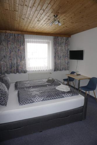 Posteľ alebo postele v izbe v ubytovaní Pension-Ferienwohnung Rotar