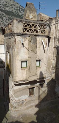 an old building with windows on the side of it at Le Terrazze Sul Pollino B&B in Civita