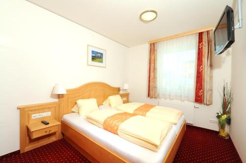 Postel nebo postele na pokoji v ubytování Hotel-Restaurant Kirchenwirt Aigen