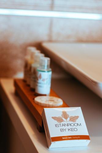 a book sitting on top of a shelf next to a table at Istanroom by Keo in Istanbul