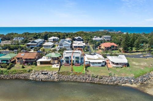 an aerial view of a house on a island in the water at Nosie 1 in Sawtell