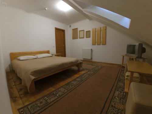 Ένα ή περισσότερα κρεβάτια σε δωμάτιο στο Hotel Zorepad