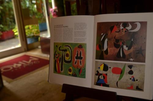 a book with paintings on the front of it at Hotel Miro' in Rapallo