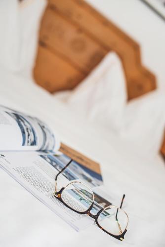 Postel nebo postele na pokoji v ubytování Hotel Post Sils Maria