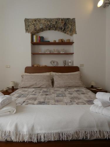 מיטה או מיטות בחדר ב-LA VALLETTA SUL MARE