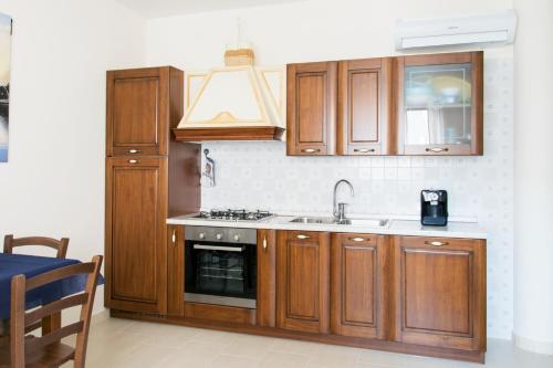 Η κουζίνα ή μικρή κουζίνα στο S'eredeu Apartments