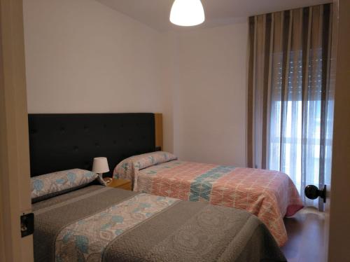 Кровать или кровати в номере Manolo piso