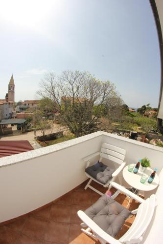 Un balcón o terraza en Room and Apartment Doris