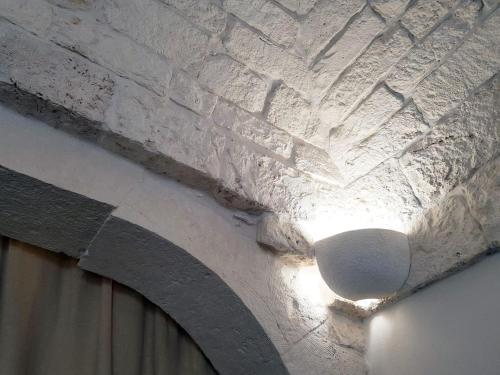 a stone ceiling with a light on it at BiancoAmore OSTUNI - the sky, the sea, the love - in Ostuni