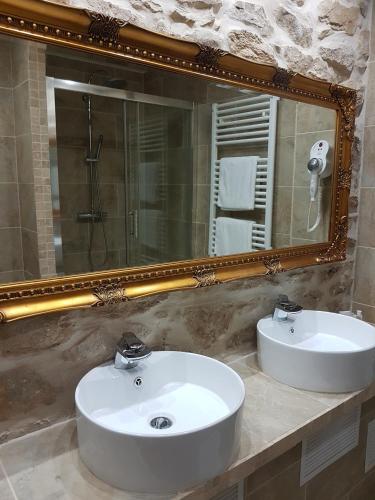 a bathroom with a white sink and a mirror at Domaine de Vareilles in Vareilles