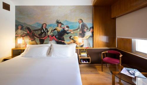 Ένα ή περισσότερα κρεβάτια σε δωμάτιο στο Hotel Goya