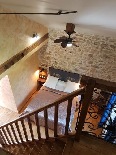 a room with a staircase and a ceiling fan at Domaine de Vareilles in Vareilles