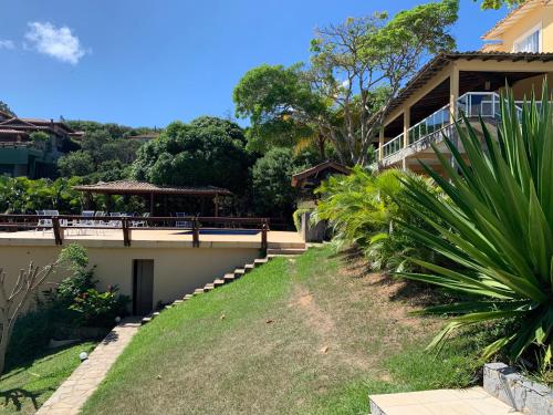 a view of a house from the yard at Praia da Ferradurinha Guest House in Búzios