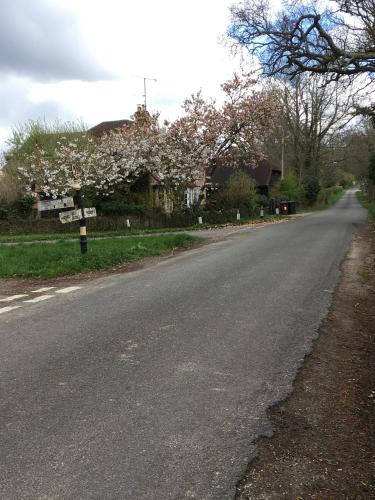 an empty road with a street sign in the middle at killarney barn in Petersfield