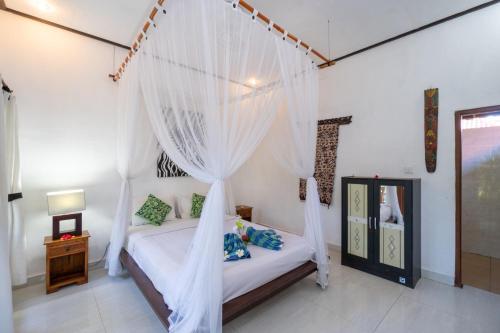 Cama o camas de una habitación en Taos House Lembongan By DeWizZ Management