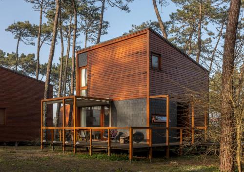 a small house in the middle of a forest at Bungalow B2 - Nature, Beach & River in Ofir