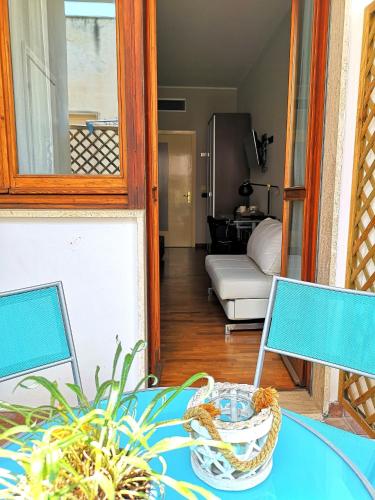 a room with a table and a living room at Attico Barocco in Lecce
