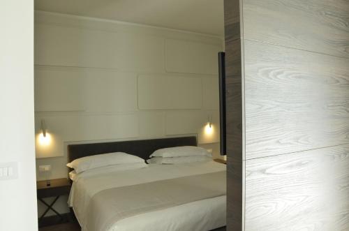 Postel nebo postele na pokoji v ubytování Solho Hotel
