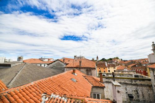 a view of a city with red roofs at GREY Apartment Old Town in Zadar