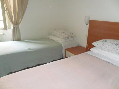 Postel nebo postele na pokoji v ubytování Albergo Romeo