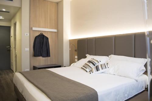 Postel nebo postele na pokoji v ubytování Hotel Alexander