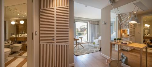 a bathroom with a toilet and a sink in a room at Hotel Bellevue Dubrovnik in Dubrovnik