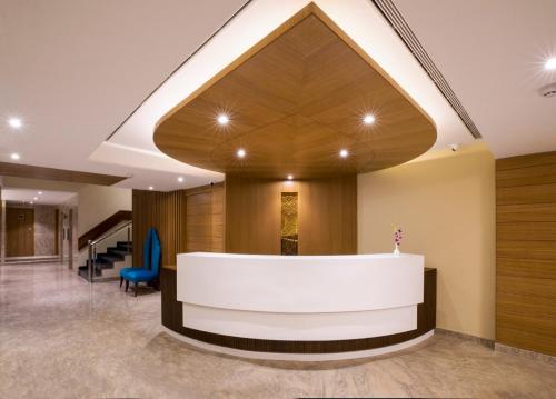 a lobby with a reception desk in a building at Regenta Central Cassia Zirakpur Chandigarh in Chandīgarh