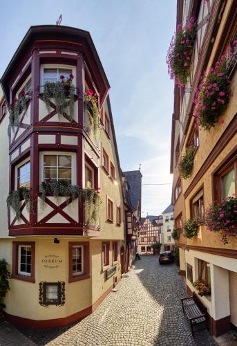 an alley in the old town of innsbruck with flowerpots at Weingut Gästehaus Derkum in Ürzig