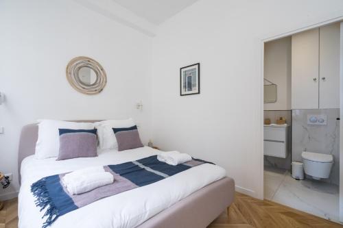 Llit o llits en una habitació de Les Residences - Oberkampf