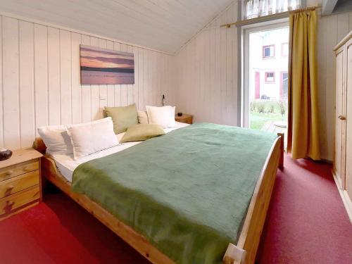 Un pat sau paturi într-o cameră la Ferienpark Scharmützelsee