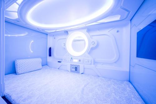 a small room with a bed in an airplane at Optimi Rooms Bilbao in Bilbao