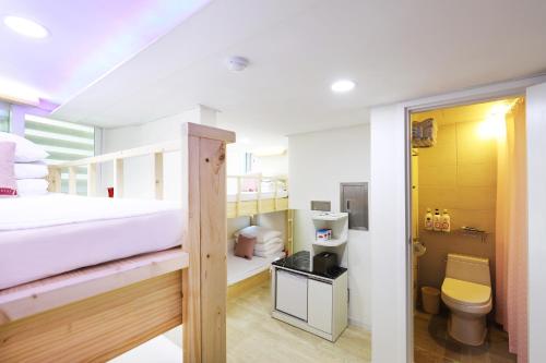 a bedroom with a bunk bed and a toilet at STAY7 Myeongdong in Seoul