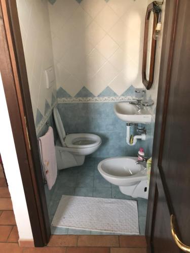 a small bathroom with a toilet and a sink at B&B Da Cleto in Gemmano
