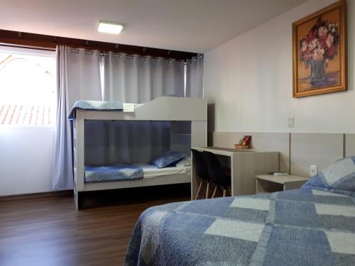Poschodová posteľ alebo postele v izbe v ubytovaní 100% Flats
