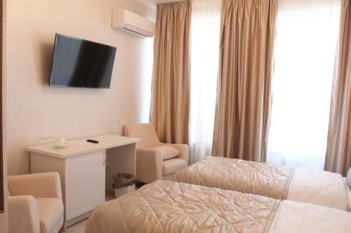 Postel nebo postele na pokoji v ubytování Guest House Roma