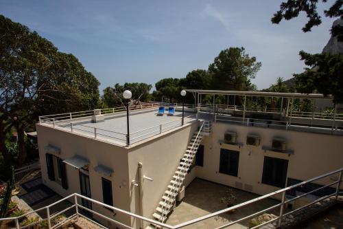 a building with a staircase on the roof at Villa Aurora Mondello Addaura in Mondello