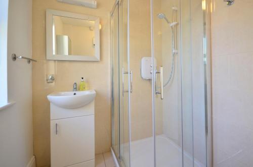 a bathroom with a shower and a sink at Cottage 139 - Clifden in Clifden