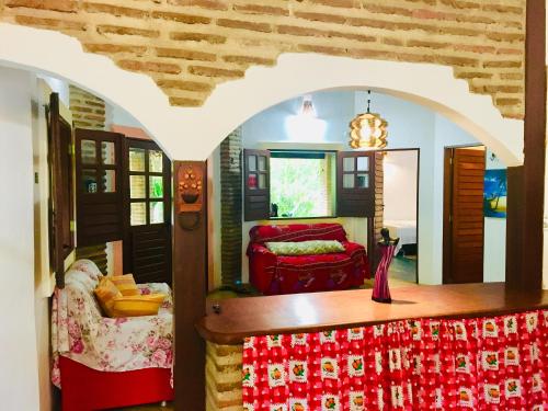 a living room with a table and a couch at Casa Jeri in Jericoacoara
