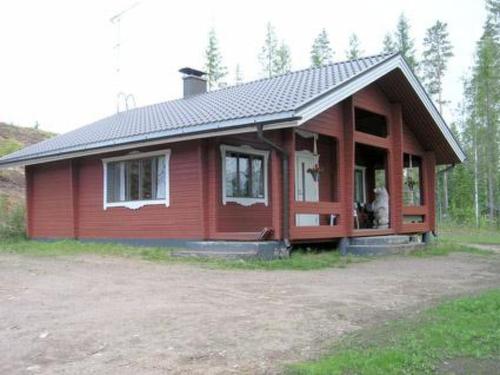 a small red house with a lot of windows at Holiday Home Hirviharju by Interhome in Torsansalo